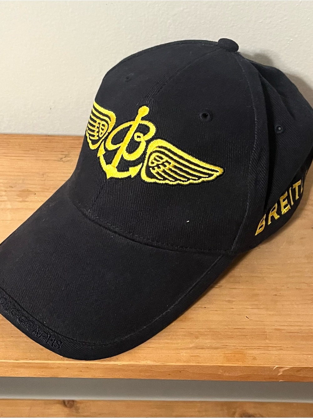 Breitling Black Cap with Yellow Winged Anchor Emblem